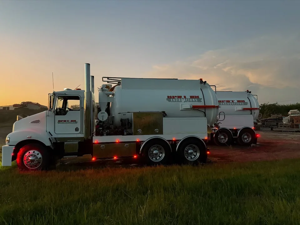 Spot On vacuum truck working at dusk on a potholing job.